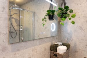 Bathroom with rain shower at Sandmartin Lodge