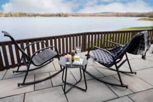 Rocking chairs on the terrace overlooking the lake at Keer Lodge
