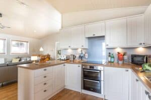 Kitchen with oven, hob and microwave at Keer Lodge