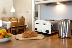 Kitchen worktop with toaster and kettle at Keer Lodge