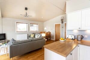 Open-plan lounge and kitchen at Keer Lodge