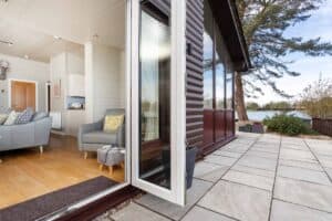 Patio doors opening onto the terrace at Keer Lodge