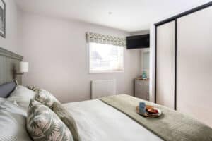 King size bed with smart TV at Keer Lodge