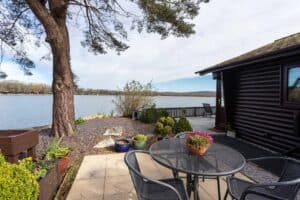 Garden and terrace by the lake at Keer Lodge